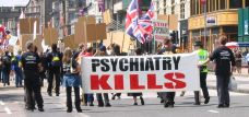 Scientologist march in an anti-psychiatry demonstration